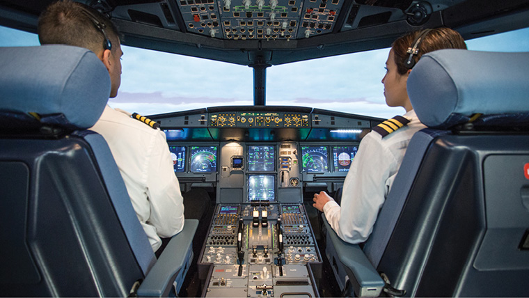 Two Pilots sitting in cockpit