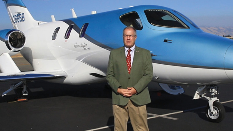 Michael Gerzanics infront of plane